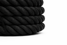 Coiled black rope on a white background