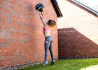Female athlete using Bulldog Gear Wall Ball 
